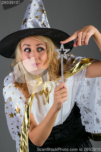 Image of Fairy with magic wand at grey background