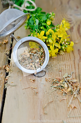 Image of Herbal tea from tutsan dry in strainer