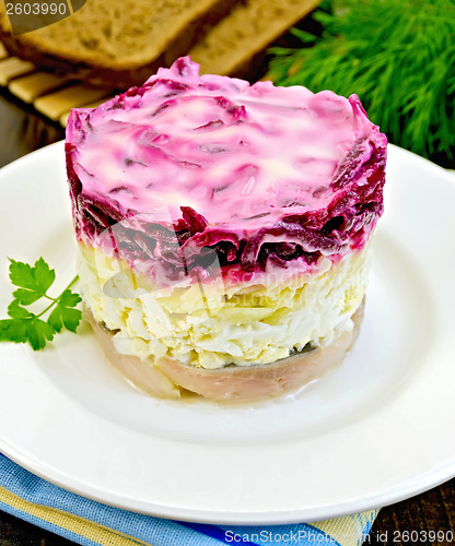 Image of Herring with vegetables in a plate with bread