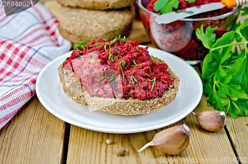 Image of Sandwich with beet caviar on board