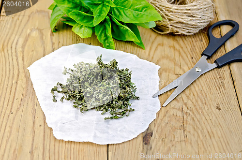 Image of Basil green fresh and dry on the board