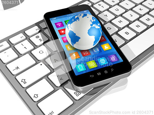 Image of Smartphone on Computer Keyboard and World Globe