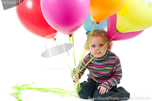 Image of Little cute girl with multicolored air balloons