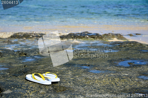 Image of Sandals at tropical coast