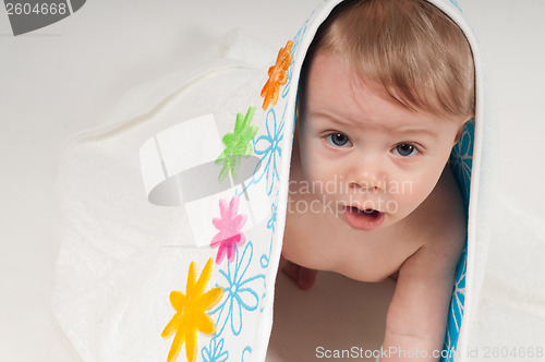 Image of Baby boy in white floral towel