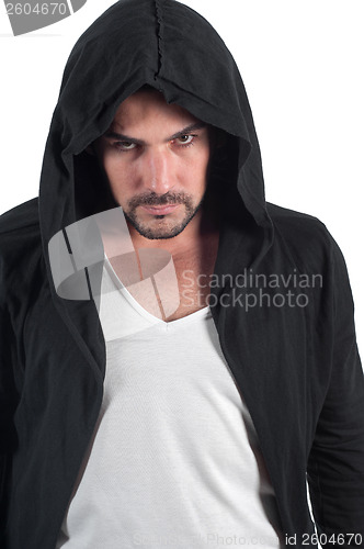 Image of A man in a hood looks askance menacingly