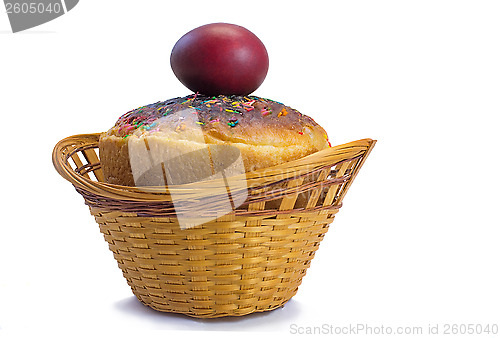 Image of Red Easter eggs and Easter bread in a basket on a white backgrou