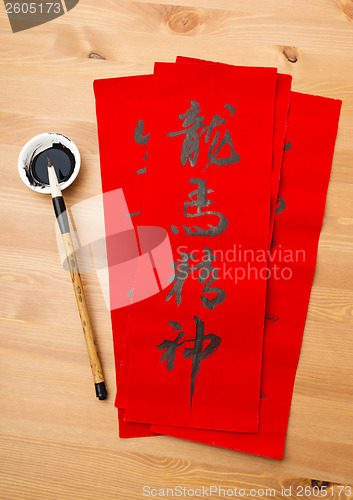 Image of Writing of lunar new year calligraphy, phrase meaning is blessin