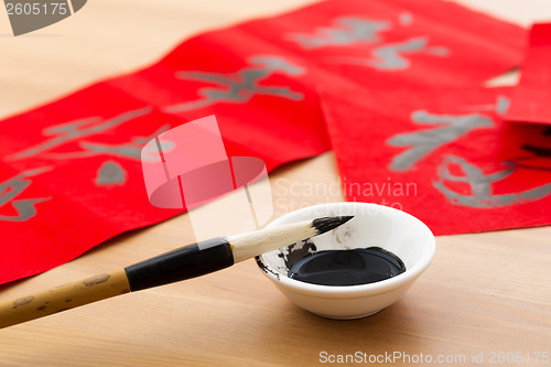 Image of Writing the couplet for chinese new year