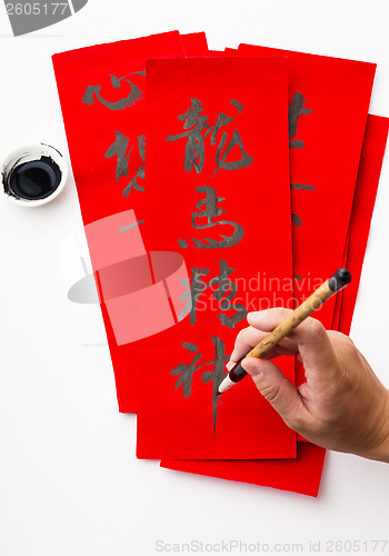 Image of Writing of the chinese new year calligraphy, phrase meaning is b