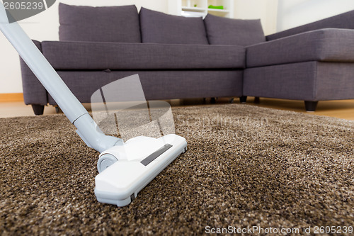 Image of Vacuum cleaner on carpet 