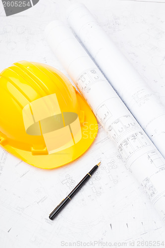 Image of Construction drawing and saftey helmet