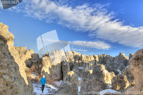 Image of hiker in Natural Fort rock formation