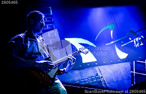 Image of musician plays a guitar