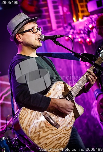 Image of musician plays a guitar