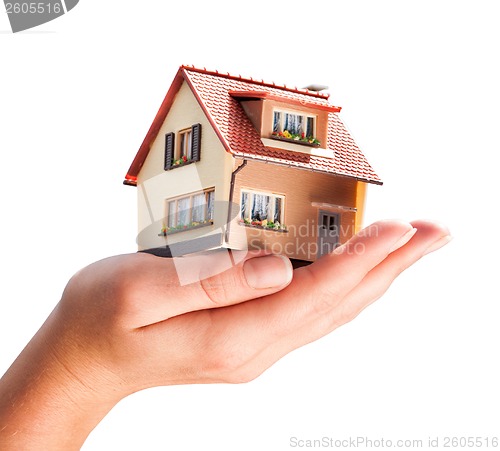 Image of house in human hands