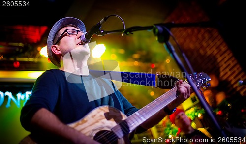 Image of musician plays a guitar