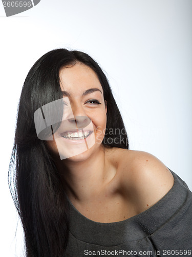 Image of Portrait of attractive young smiling woman on white