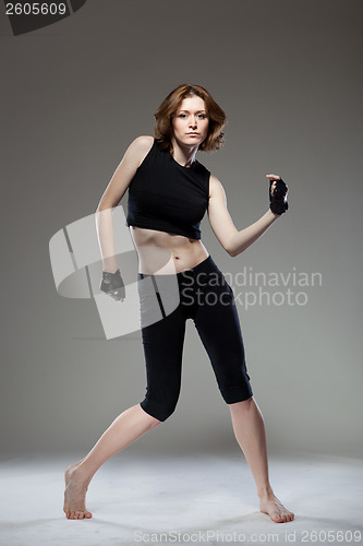 Image of attractive young woman dancing