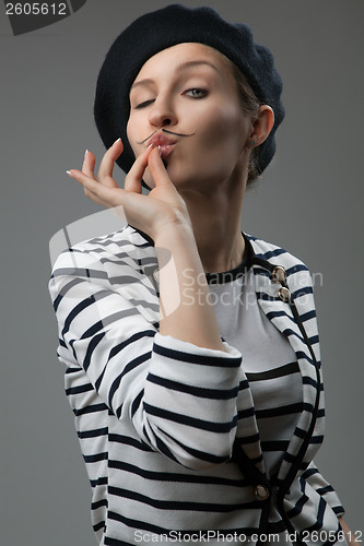 Image of young woman shows that taste is delicious