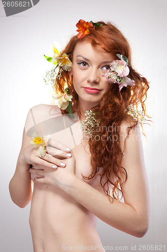 Image of Portrait of beautiful naked woman with spring flowers 