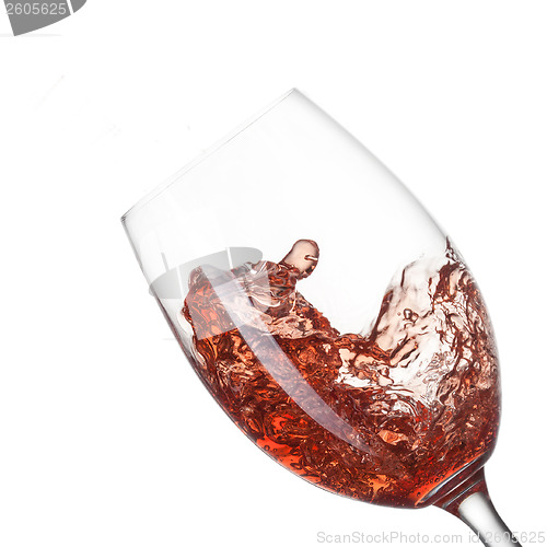 Image of Red wine pouring into glass with splash isolated on white