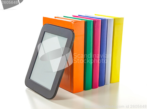 Image of Electronic book reader with hard cover books