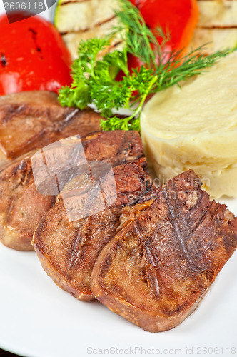 Image of tongue with grilled vegetable