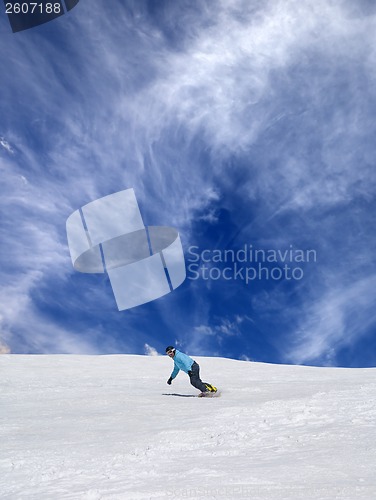 Image of Snowboarder on off-piste ski slope