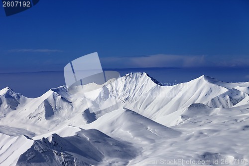 Image of View on off-piste snowy slope at nice sunny day