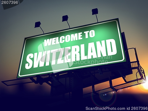 Image of Billboard Welcome to Switzerland at Sunrise.