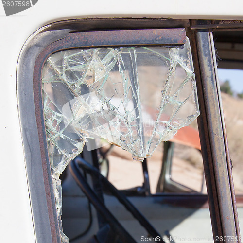 Image of Old dirty car with busted window