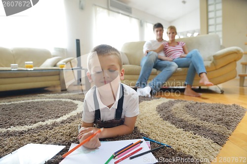 Image of family drawing on school board at home