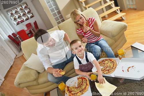 Image of family eating pizza