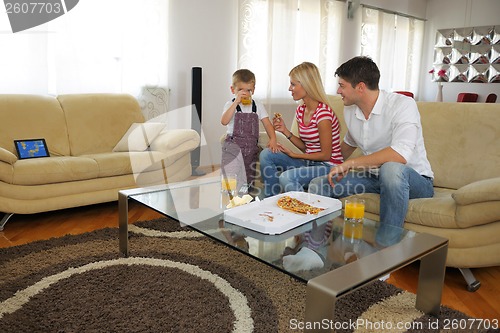 Image of family eating pizza