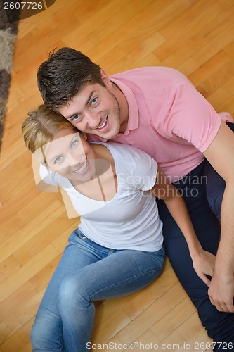 Image of Relaxed young  couple watching tv at home