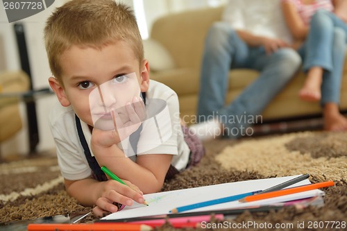 Image of family drawing on school board at home