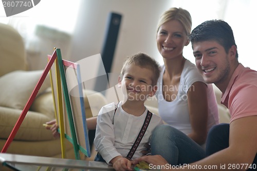 Image of family drawing on school board at home