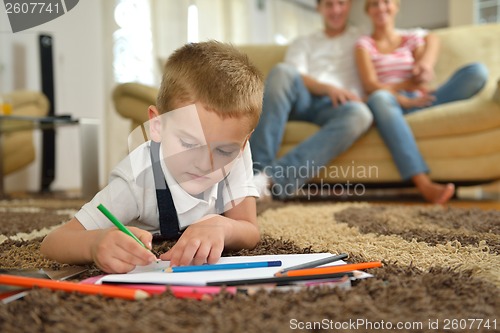 Image of family drawing on school board at home