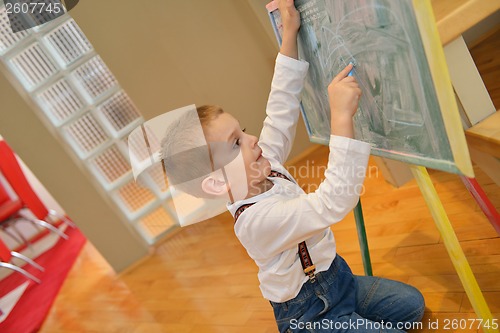 Image of family drawing on school board at home