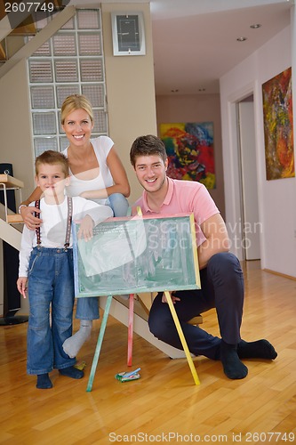 Image of family drawing on school board at home