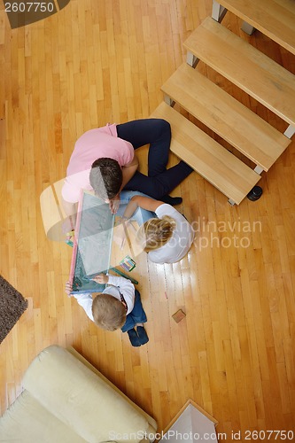 Image of family drawing on school board at home