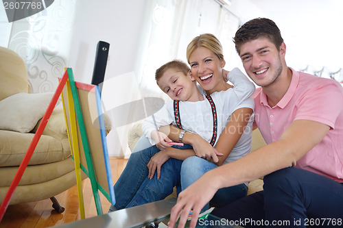 Image of family drawing on school board at home