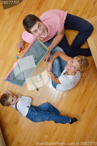 Image of family drawing on school board at home