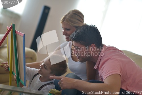 Image of family drawing on school board at home