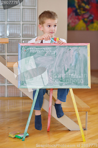 Image of family drawing on school board at home