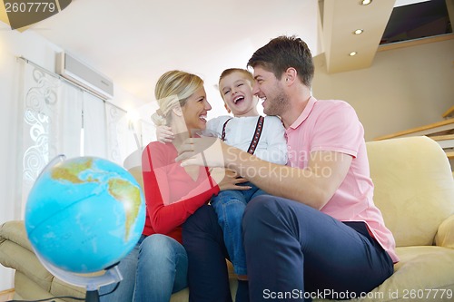 Image of family have fun with globe