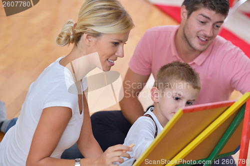 Image of family drawing on school board at home