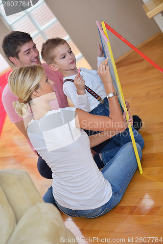 Image of family drawing on school board at home