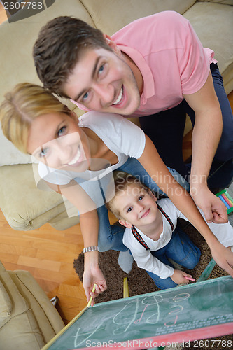 Image of family drawing on school board at home